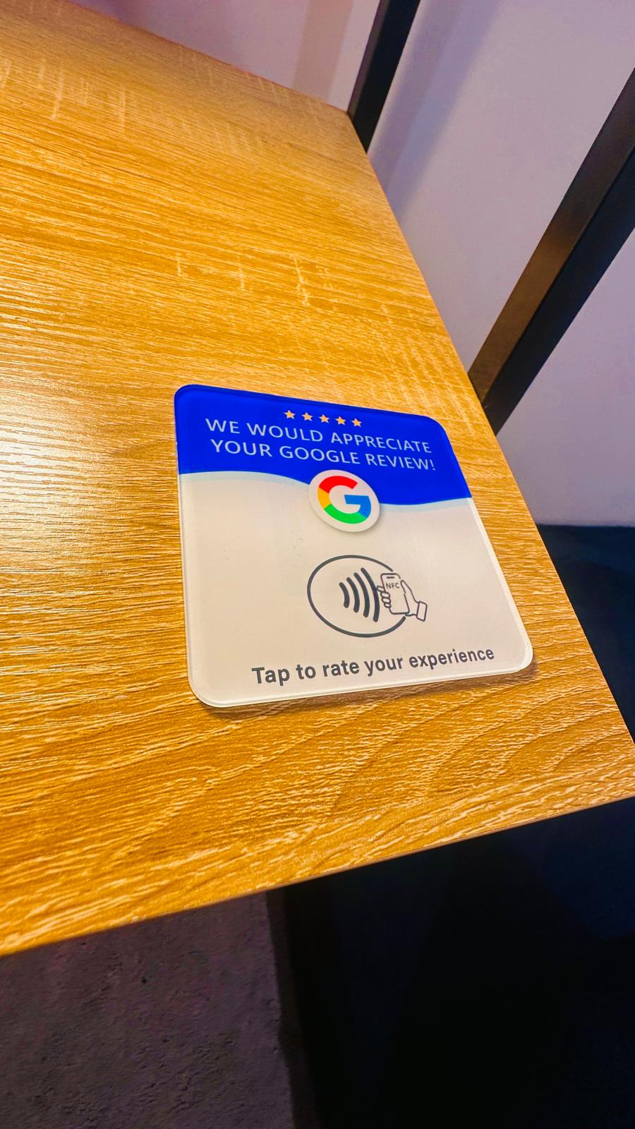 ReviewBoost NFC card close up on a wooden table