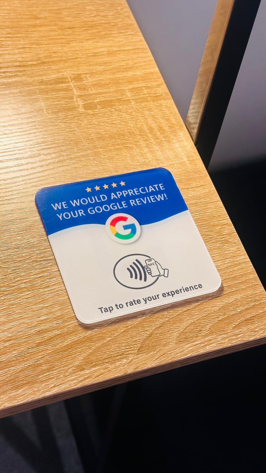 ReviewBoost NFC card on a wooden table